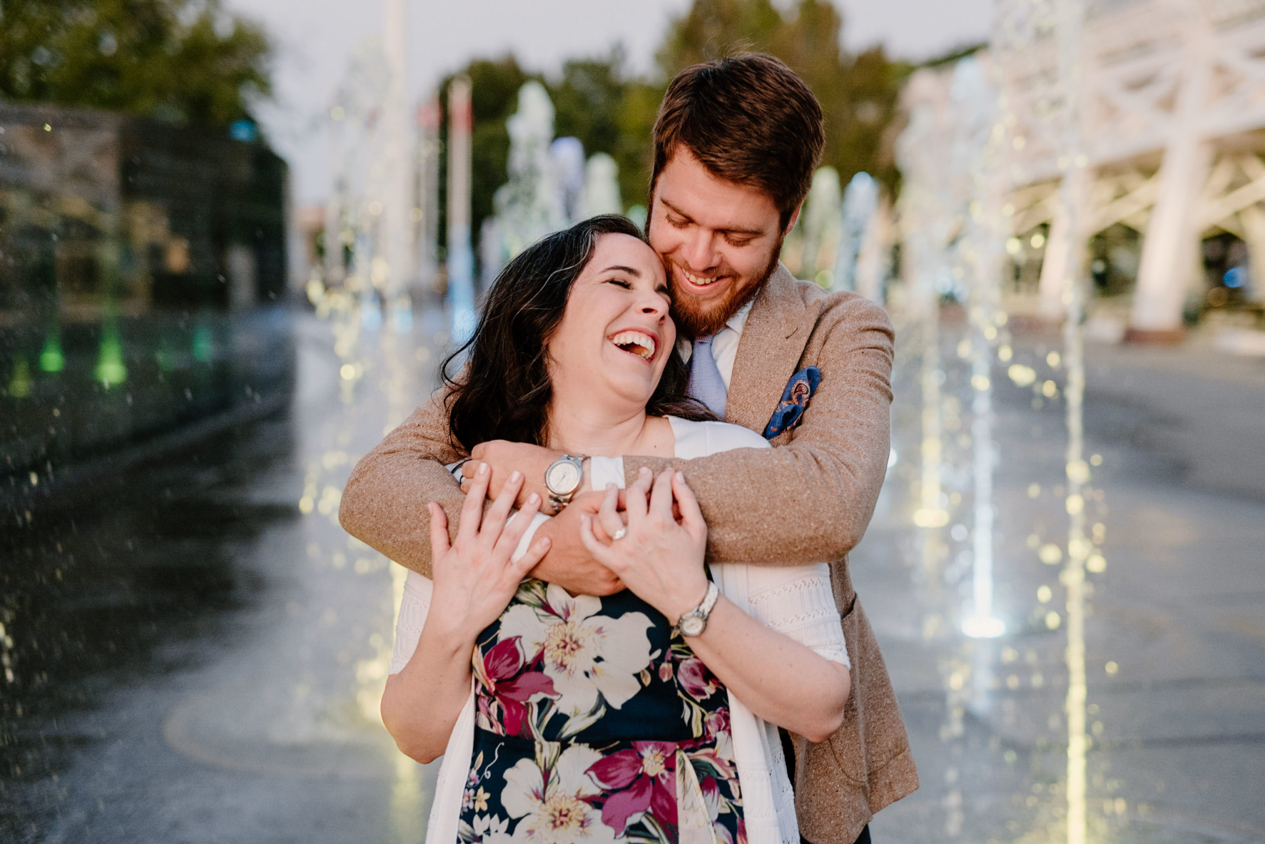 Happy laughing couple at their downtown nashville engagement session by sara bill photography nashville wedding photographer