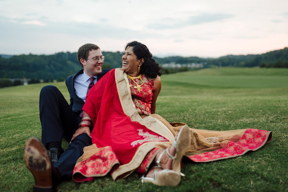 indian american wedding at the blackthorn club wedding couples photos at sunset with blue ridge mountains in the background by nashville wedding photographer sara bill photography