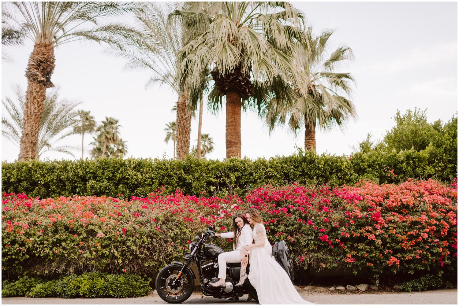 creative downtown palm springs elopement portraits with blooming begonias and motorcycle